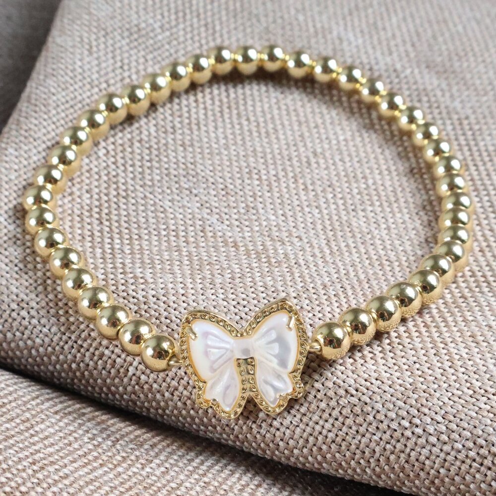Haley Bow Gold Mother-of-Pearl Stretch Bracelet by Kendra Scott